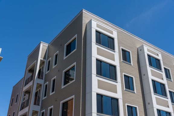 a tall building with windows and a blue sky at Union 346, Somerville, MA