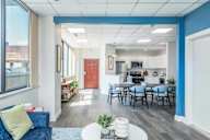 Community room at Babcock Tower with kitchen and seating