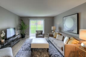 spacious living room with modern furnishings and patio access