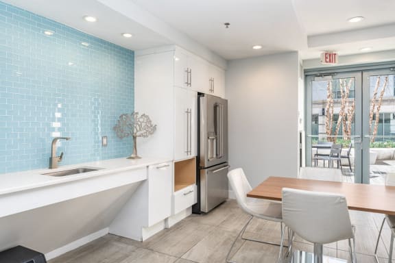 a kitchen and dining area with a table and chairs