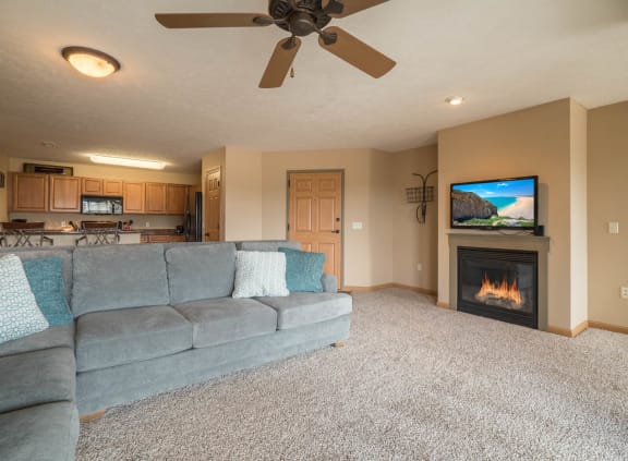a living room with a couch and a fireplace
