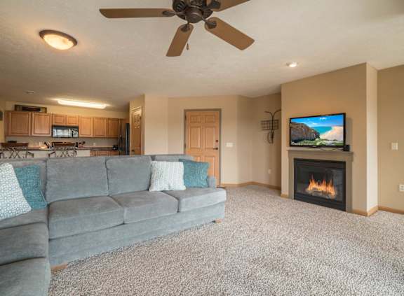 a living room with a couch and a fireplace