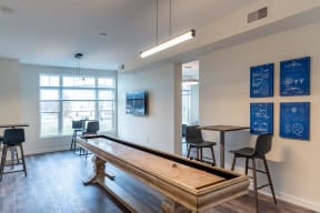 a game room with a pool table and a bar