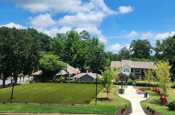 New green space with corn hole and grills at Addison on Cobblestone, Georgia