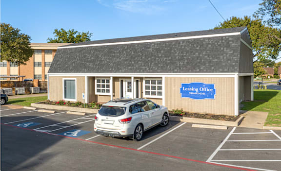 A small building with a sign that says Leasing Office.