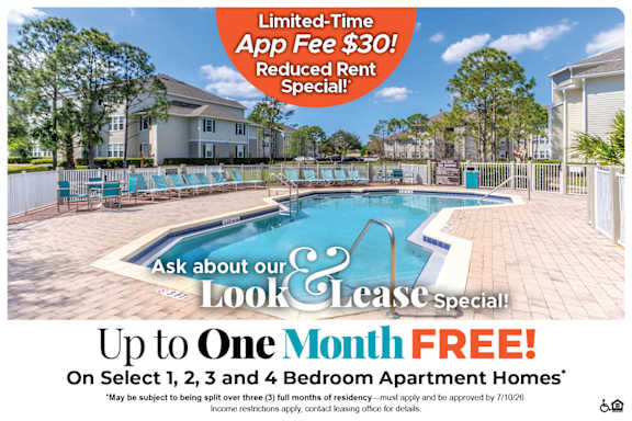 A pool with a sign that says $500 off move-in costs on select 4 bedroom apartment homes.
