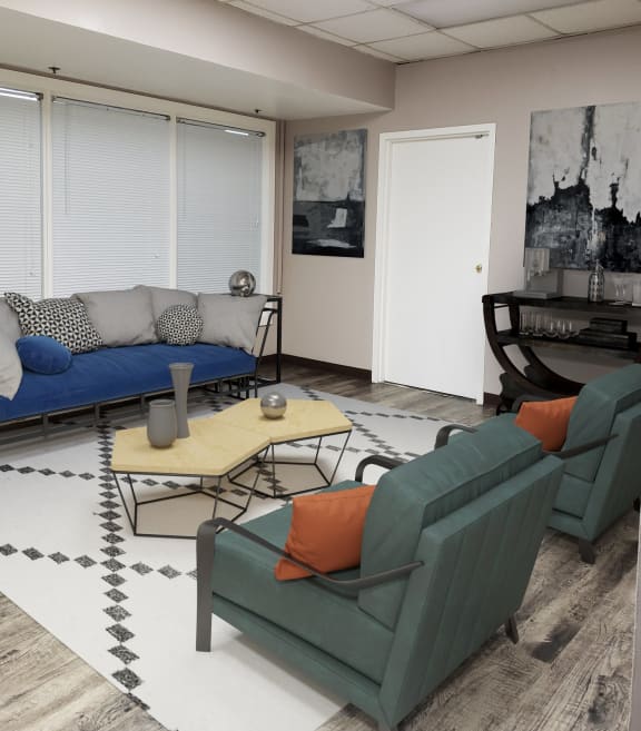a living room with a blue couch and two green chairs at Delmar Loop Apartments, Missouri