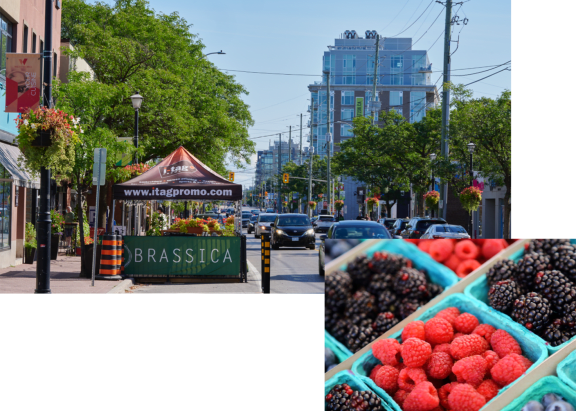 a fruit stand on the side of a city street