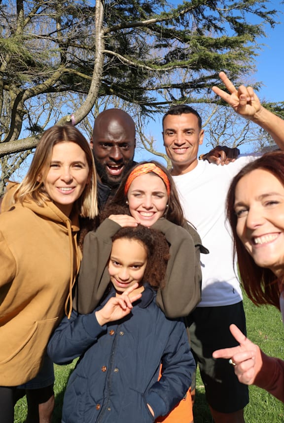 A group of people are standing together outdoors.
