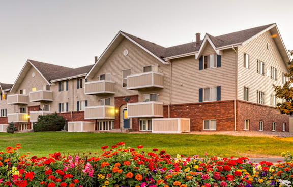 A large building with a lawn in front of it.