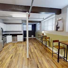 Kitchen with wooden floors at Emerson Shoe Lofts Apartments, Rockland, MA