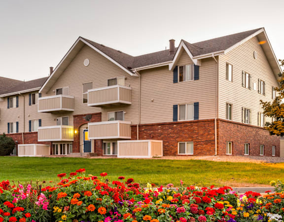 A large building with a lawn in front of it.