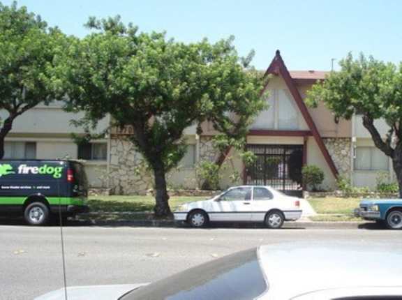 a house with cars parked in front of it
