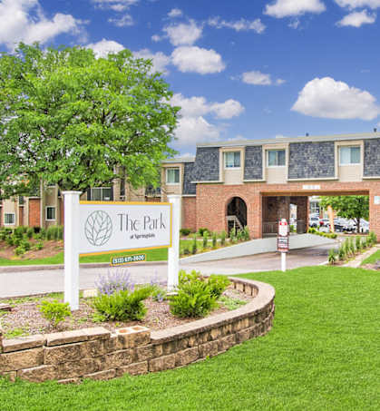 The front of a building with a sign that says The Park.