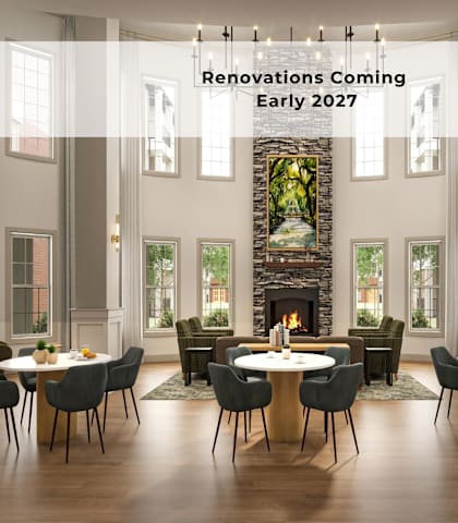 A modern dining room with a fireplace and a sign that says Renovations Coming Early 2027.