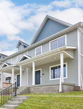 our apartments have a pool and lounge chairs around it at Two Rivers Home Rentals, Iowa