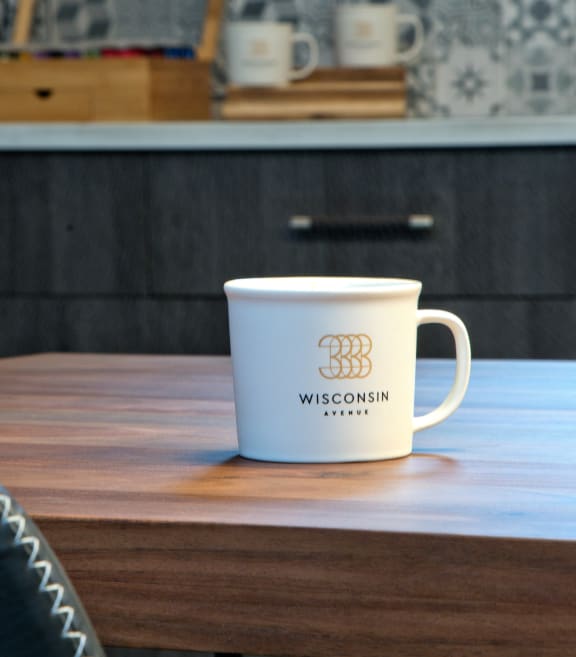 a cup of wisdom on a table at 3333 Wisconsin, Washington, 20016