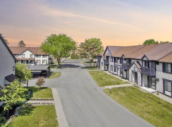 a row of houses on the side of a road
