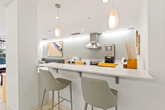 a kitchen with a counter top and chairs at The Parker in Portland, Oregon