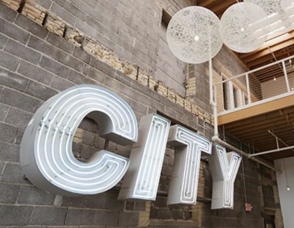 a city sign on the side of a building