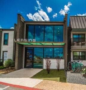 a modern building with a bike parked in front of it