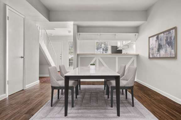 A dining room with a table and chairs at Chevy Chase in Austin, Texas
