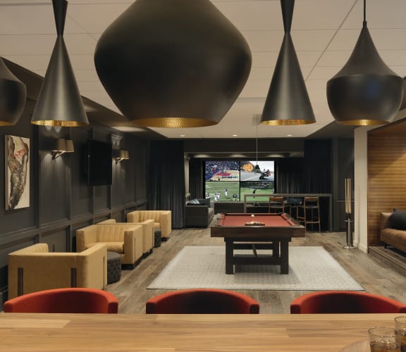 Clubroom with pool table, conversational seating and multiple televisions  at Clayton On The Park, Missouri, 63105