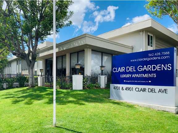 A sign for Claire Del Gardens Luxury Apartments  at Clair Del and Clair Del Gardens, Long Beach, CA
