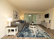 Thumbnail 2 of 25 - Living room with a couch and a coffee table at Village of Pine Run Apartments & Townhomes*, Baltimore, MD