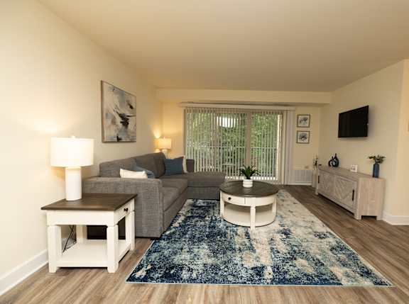 Living room with a couch and a coffee table at Village of Pine Run Apartments & Townhomes*, Baltimore, MD
