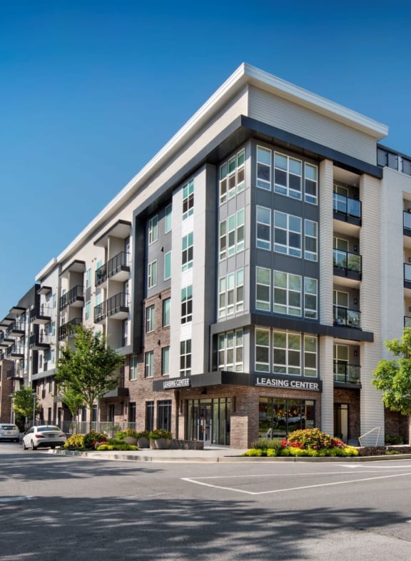 a large apartment building with a parking lot in front of it at Glenn Perimeter, Georgia