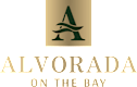 A logo with a tree and the words "ALVORADA ON THE BAY" in gold.