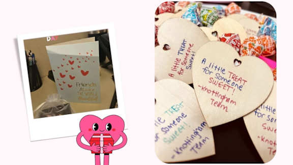 A collection of heart-shaped tags with handwritten messages.