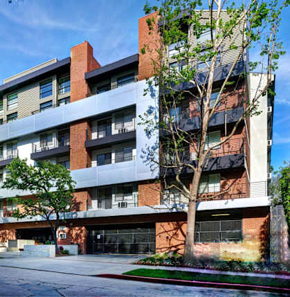 A modern multi-story building with balconies and large windows at 1022 Tiverton, Los Angeles