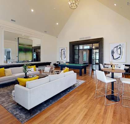 the living room is open to the dining room and kitchen at The Fitzroy San Marcos, San Marcos, TX