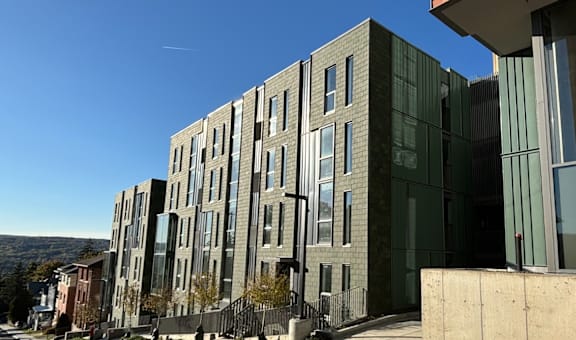 a row of modern buildings on a city street