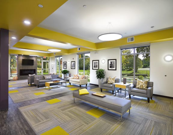 the lobby of a building with a fireplace