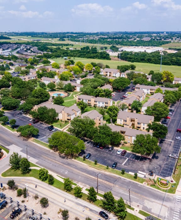 an aerial view of a neighborhood with cars parked on the street at Summit Ridge Apartments, Temple, 76502