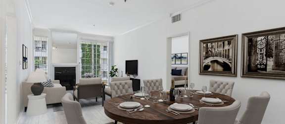 a kitchen with white cabinets and a window