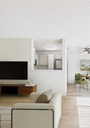 A living room with a television, a couch, a chair, and a dining table.