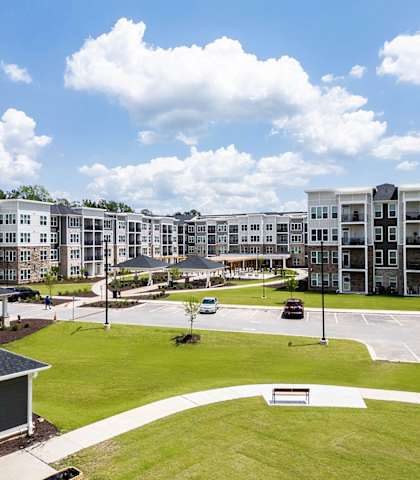 an aerial view of an apartment complex with a parking lot and lawn at Haven at Congaree Pointe 55+ Apartments, Columbia, 29209