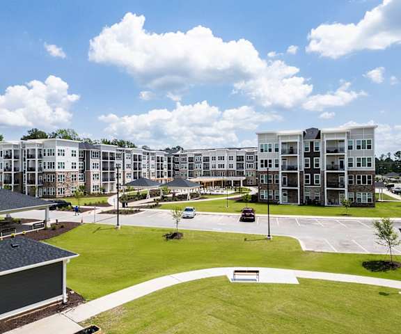 an aerial view of an apartment complex with a parking lot and lawn at Haven at Congaree Pointe 55+ Apartments, Columbia, 29209