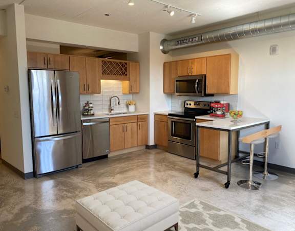 Fully Equipped Kitchen In Clubhouse at 700 Central Apartments, Minneapolis, MN