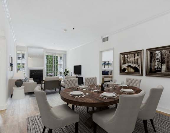 A dining room with a table set for six.