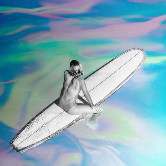 a person riding a surf board on a body of water