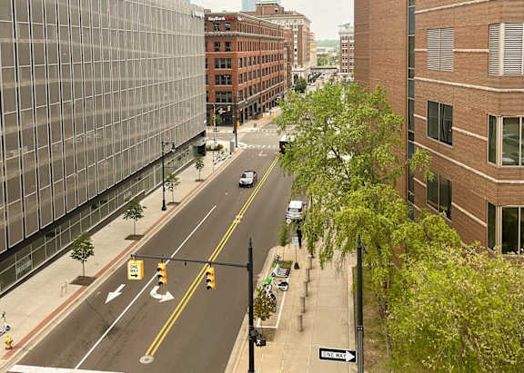 a city street with tall buildings on either side