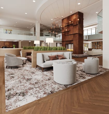 a rendering of the lobby of a hotel with couches and chairs