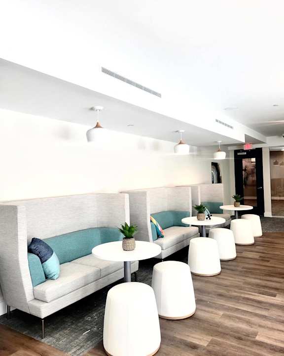 Luxurious lounge at NOVI with booths, cushions, and tables.