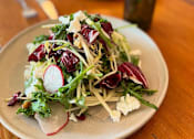 Thumbnail 45 of 46 - A plate of salad at Bautista Apartments, Tucson, AZ