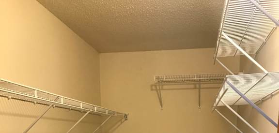 a walk in closet in a 555 waverly unit